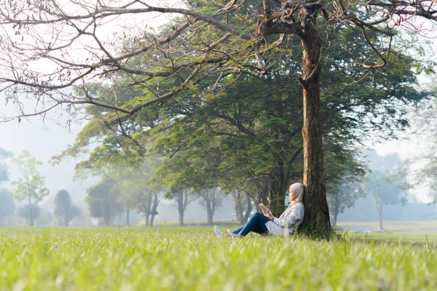istock Reading or Writing outdoor during summertime 2155549407
