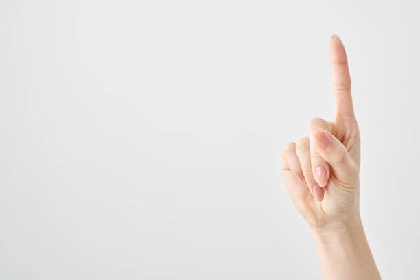 istock A woman's index finger pointing upwards 2155553320