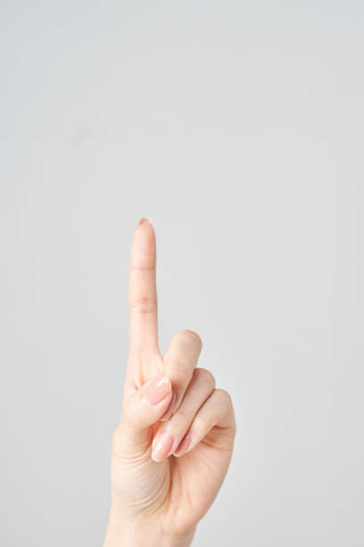 Female hand pointing isolated