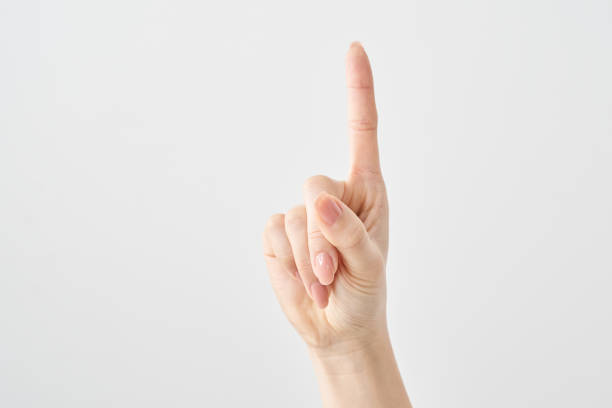 istock A woman's index finger pointing upwards 2155553359
