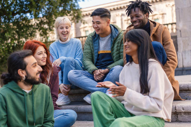istock Multicultural Friends Enjoying Conversation Outdoors 2155554204