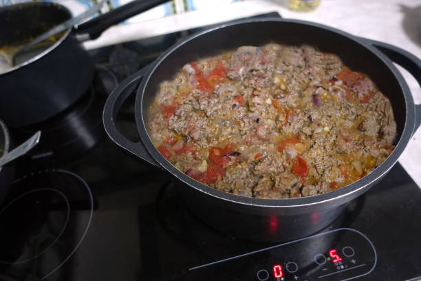Preparing a spicy beef and lamb stuffing during cooking