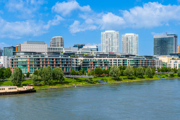 Bratislava, Slovakia - June 2022: Eurovea skyline, commercial and residential complex of buildings in downtown Bratislava; Apollo bridge over Danube river