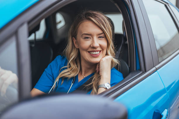 istock Smiling Caucasian Nurse Enjoying Break in Vehicle 2155559269