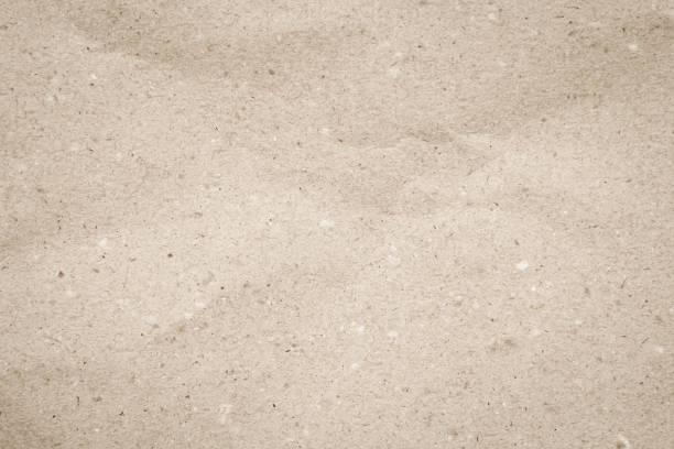 Old paper vintage texture surface for background. Recycle pale brown paper crumpled texture, Cream color recycled kraft paper texture blank with copy space for text.
