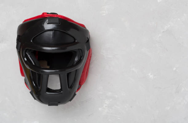 istock Black leather boxing helmet on concrete background, top view. 2155559993