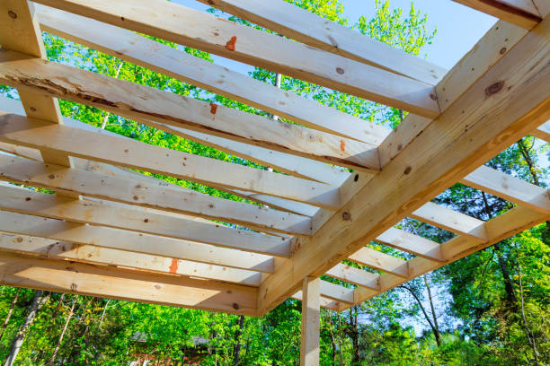 istock Installing framing beams a wooden trusses during remodeling 2155561209