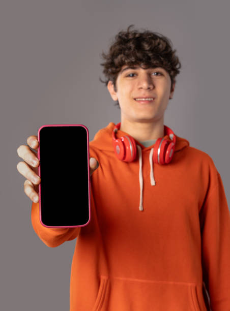 istock Teenager Showing Smartphone Screen - Modern Technology Display 2155561807