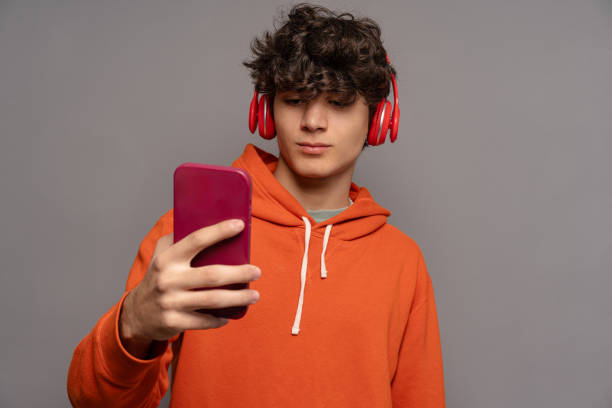 istock Teenager Taking Selfie with Smartphone - Modern Technology Use 2155561809