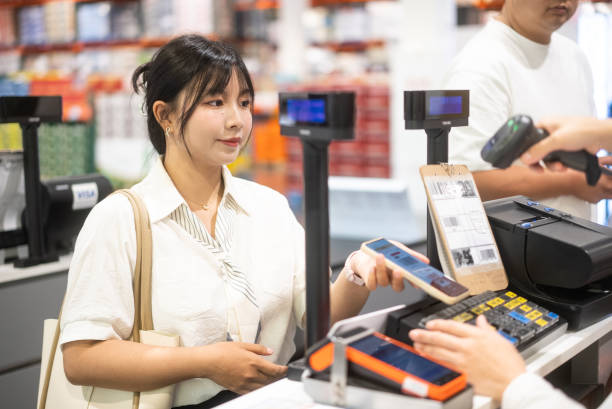 istock contactless payment in supermarket via QR code 2155563894