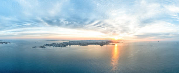 istock QingDao city sunrise at sea 2155566747