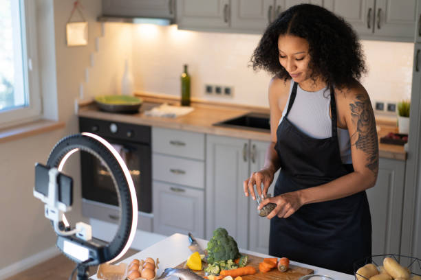 istock Woman filming live cookery demonstration 2155567320