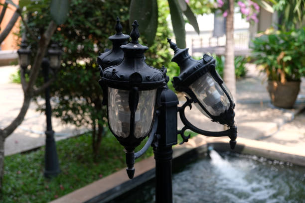 black street lights near the pool