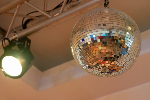 istock disco ball is hanging from the ceiling, reflecting light and creating a fun 2155571080