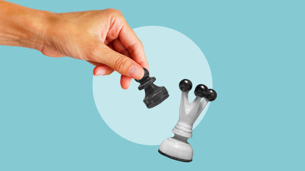 istock Competitive strategy. Creative abstract template collage of hand holding chess pawn which winning chess queen. Intellectual game strategy politics playing 2155572942