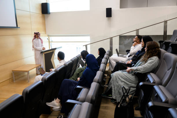 istock Saudi university students in lecture hall with professor 2155573434