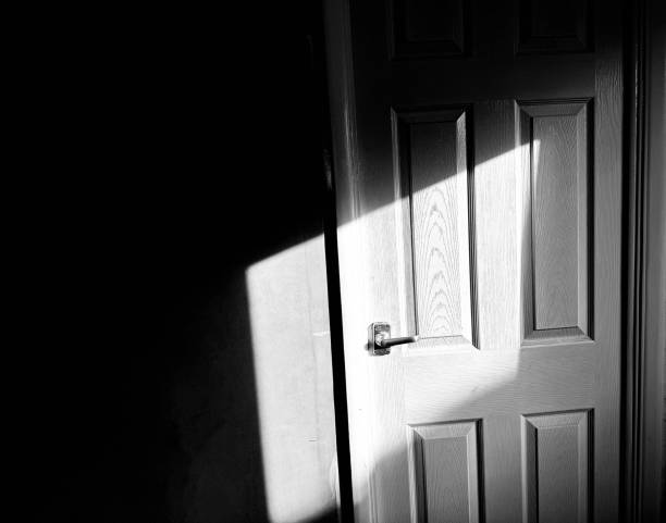 istock A shadow cast across an interior door in a domestic setting 2155579583