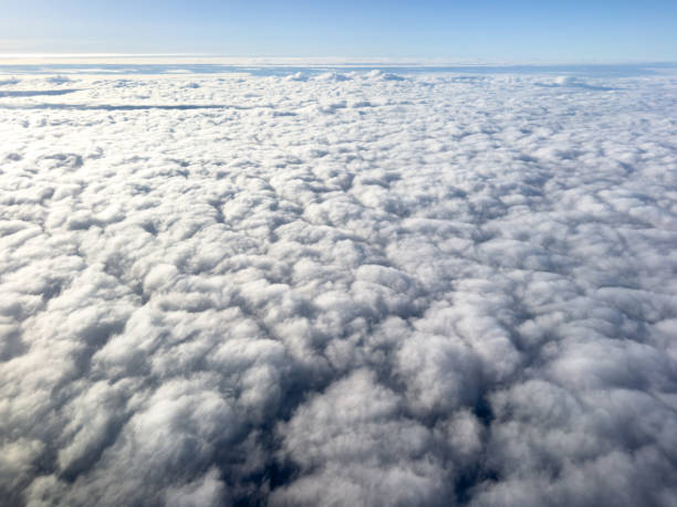 istock Aerial view white clouds in blue sky. Aerial top view cloudscape. Texture of clouds. View from above. Sunrise or sunset over clouds. Panorama sky 2155580047