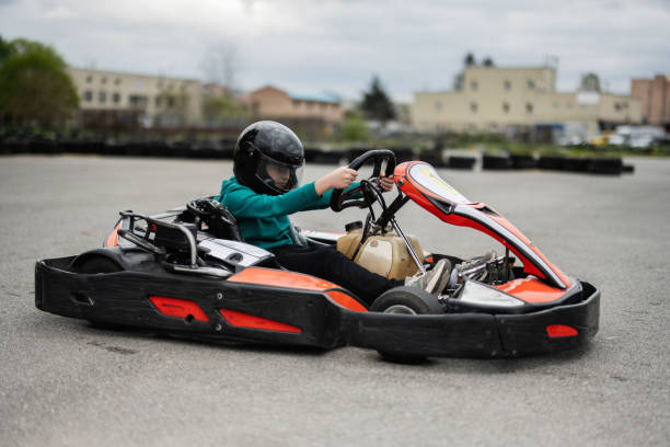 istock Go-Kart Racing Action With Focused Driver In Black Helmet 2155581933
