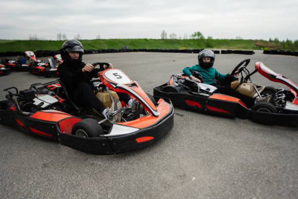istock Children Enjoying Go-Kart Racing Outdoors for a Fun and Exciting Adventure 2155582012
