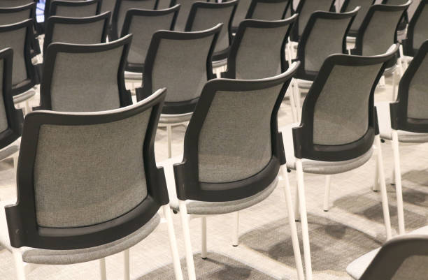 istock Row of empty chairs in conference room. 2155585507
