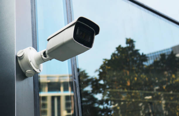 istock CCTV camera outdoor installed on building wall. 2155585727