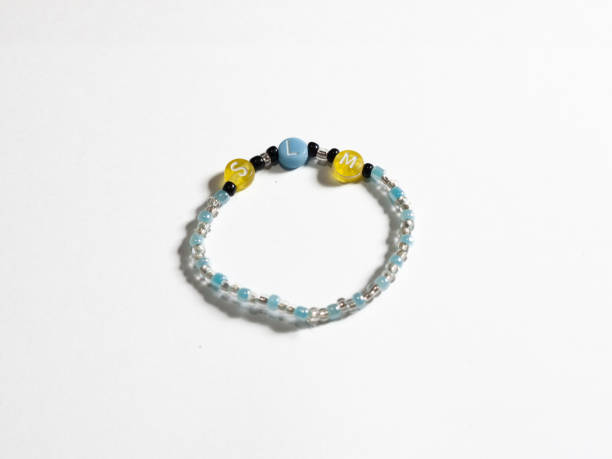 istock Simple children's bracelet isolated on white background. 2155586072