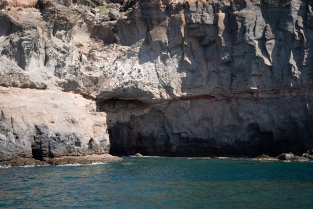 Several caves on a cliff in Puerto de Mogan, Gran Canaria Spain.