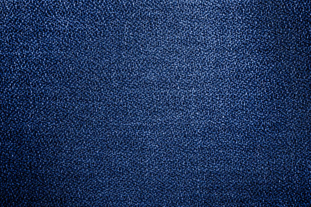 Closeup of blue-purple textured cloth background for design purpose