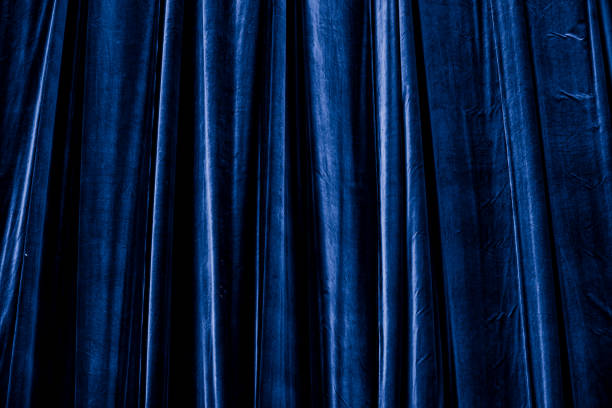 istock blue-purple curtain in theatre background 2155588077