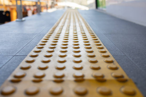 istock A yellow line with black dots on a gray surface 2155591166