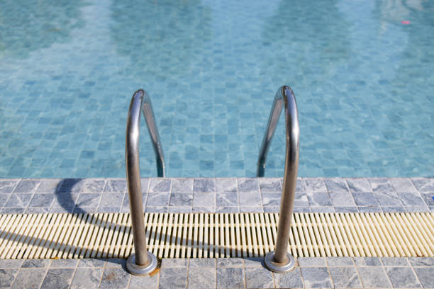 The pool is empty and the ladder is up