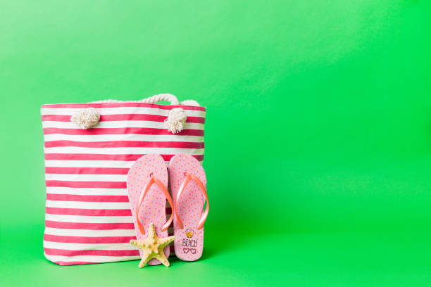 istock Stylish bag with beach accessories . Summer holiday concept. beach bag with straw hat with space for text 2155595864