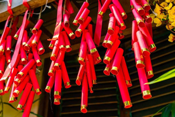 Chinese New Year Decoration Firecrackers with a blurry background.Character on background symbolizes good luck.