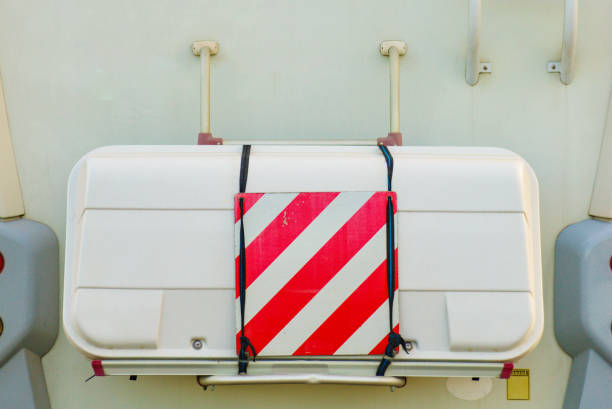 Camper rv with storage box container on back and rear warning sign for safety. Motorhome equipment.