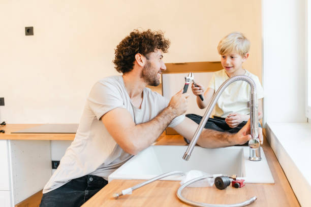 istock Father and son assembling kitchen furniture 2155603415