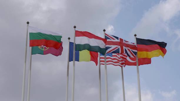 istock Various national flags with the EU flag under a blue sky. 2155604424