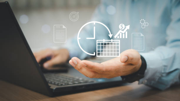 istock Time management concept. Businessman using laptop with time management icon on virtual screen. Work planning for increases efficiency and reduces work time. Business project planning. 2155605407