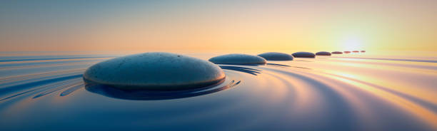 istock Row of stones in wide ocean 2155605557
