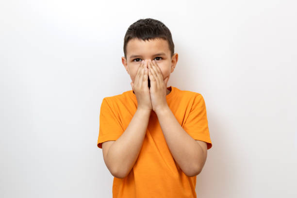 istock The boy covered his face with his hands. Sincere children's emotions. 2155605620