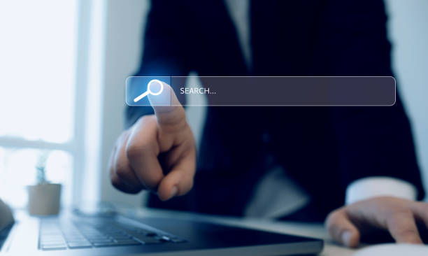 istock Businessman hands clicking internet search page on touch screen.  Searching information on internet. SEO searching. 2155607028
