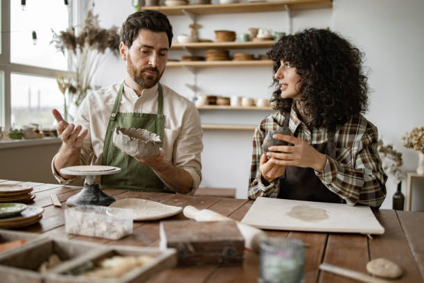 istock Mature man and woman crafting pottery in art studio 2155607616
