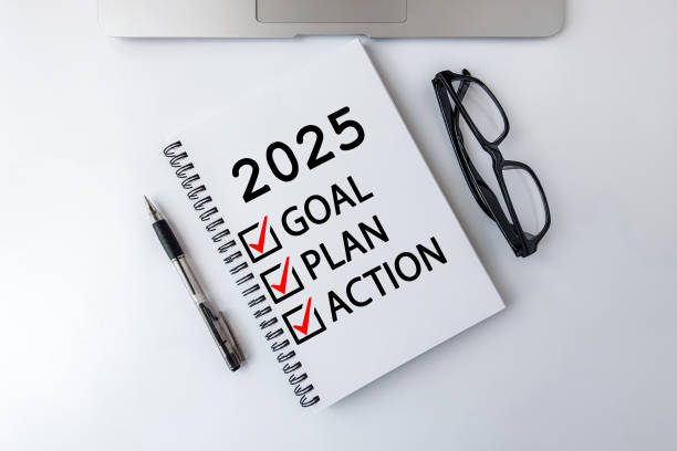 istock 2025 Goal, Plan, Action checklist text on note pad with laptop, glasses and pen. 2155607734