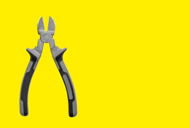 istock Industrial pliers, diagonal cutting tool for wire and cable. Yellow background with copy space, 2155608097