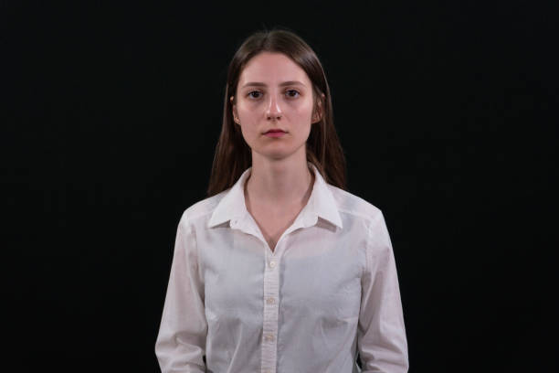 Confident business lady smiling at camera. Black Background