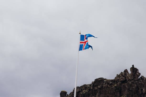 Low-angle view of Icelandic flag in Thingvellir National park