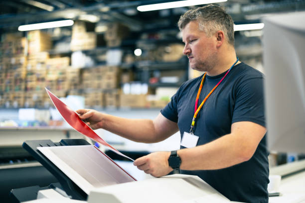 istock Man working in a printing factory 2155612107