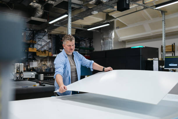 istock Man working in a printing factory 2155612156