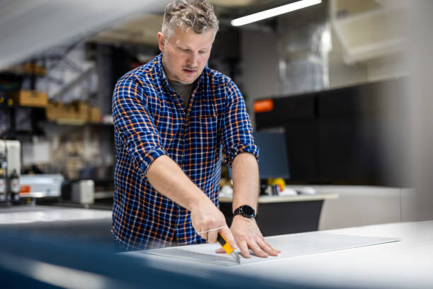 istock Man working in a printing factory 2155612176