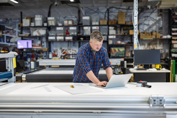 istock Man working in a printing factory 2155612177